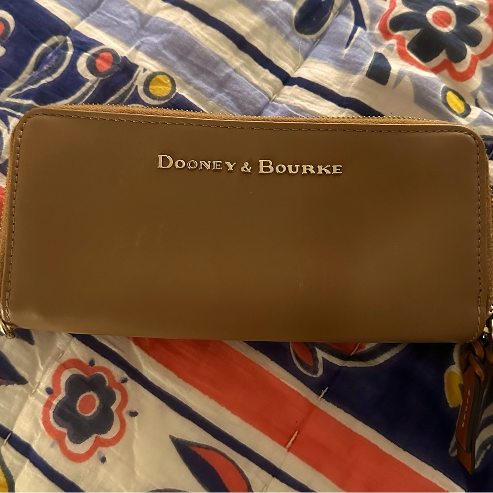 Dooney and Bourke large leather wallet. In great used condition.
